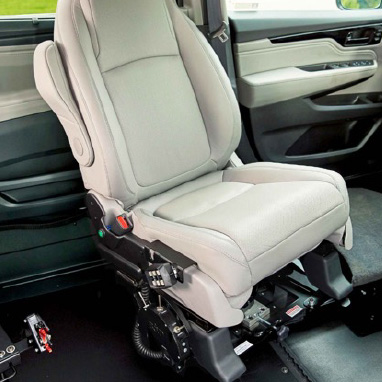 Car seat that swivels out and lowers down for wheelchair accessibility 